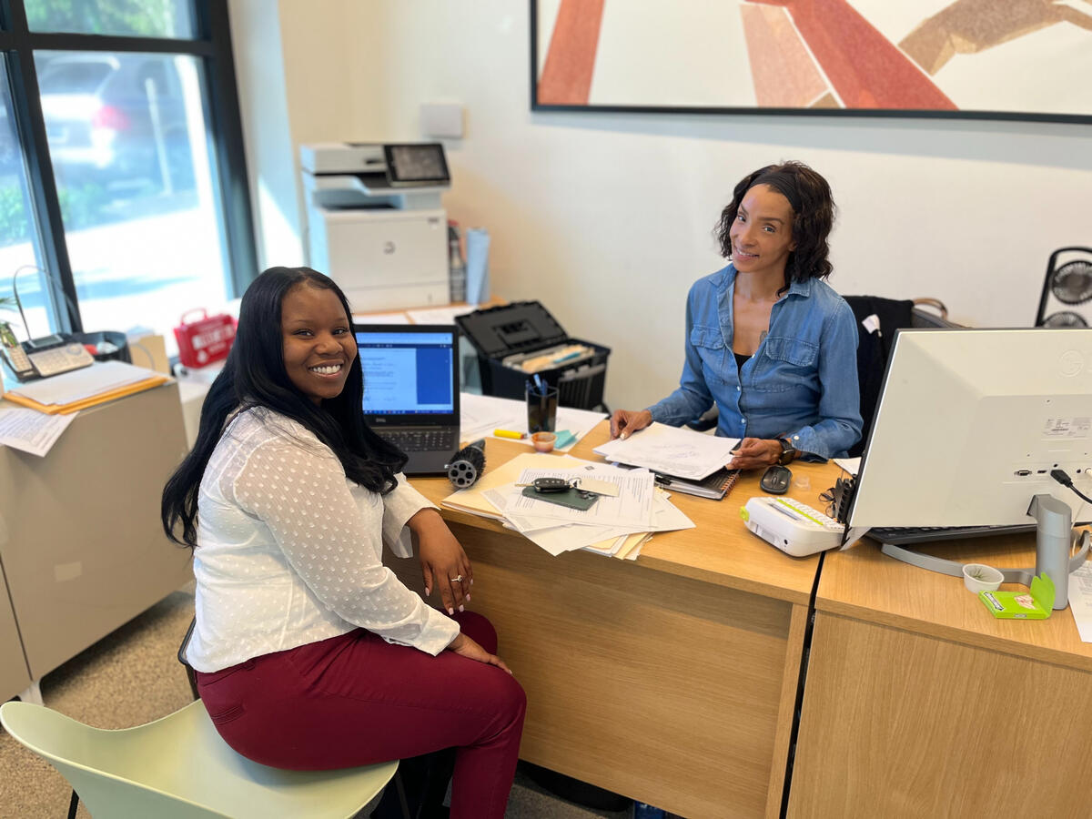 Everyone's favorite housing counselor helping a new resident with her paperwork.
